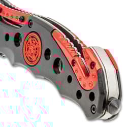 Close-up of Ridge Runner knife handle with red accents