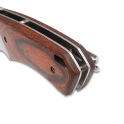 Close-up of wooden handle on a folding knife
