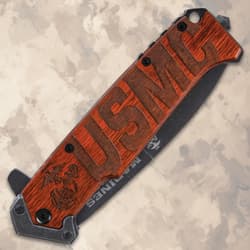 Closed knife showing USMC engraving on handle