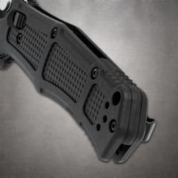Close-up of black knife handle with textured grip