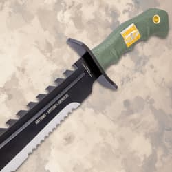 Bowie knife with green handle and engraved blade text