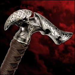 The ornate cast metal handle with leather wrappings of the blade seamlessly blends with the black cane shaft.