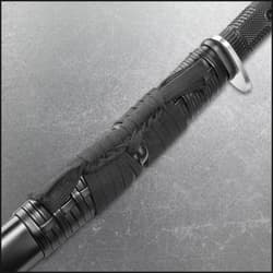 Close view of honshu katana sword encased in black leather sageo