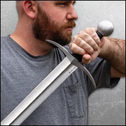 A person holding the sword.