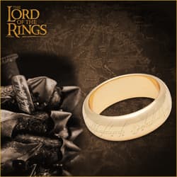 Gold ring with inscription on dark map background
