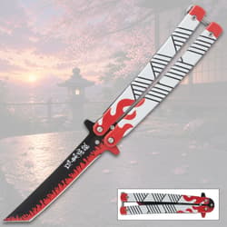 Butterfly knife with flame design on a scenic background
