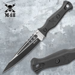 Single M48 tactical knife with black handle on a textured background