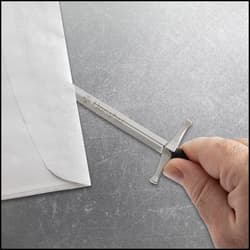 Hand holding a sword-shaped letter opener