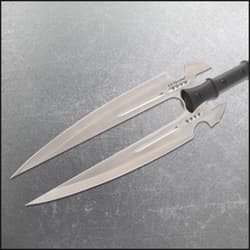 Close-up of twin stainless steel blades with black handle