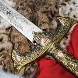 Close-up of sword hilt with intricate gold detailing on fur