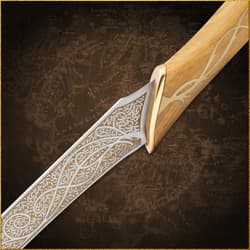 Close-up of a sword blade with detailed engravings