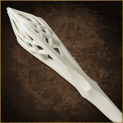 Close-up of the top of a white staff with lattice design