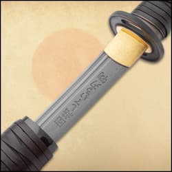 The hand-lacquered wooden scabbard has a mottled color-scheme and leather wrapping.