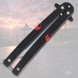Closed black butterfly knife with red design, cherry blossom scene