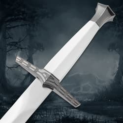 Close-up of sword hilt and handle, wolf silhouette