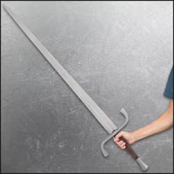 Angled view of the black leather wrapped handle with circular pommel and decorative guard accent.