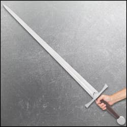 Person holding a long medieval sword with a brown handle