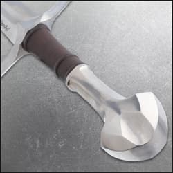 Close-up of sword pommel and leather-wrapped grip