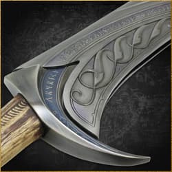 Detailed view of sword hilt with runes and wood handle