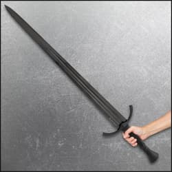 Person holding a black broadsword on a gray background