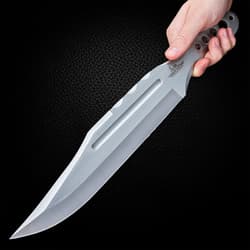 Mirror polished "Gil Hibben" throwing knife imbeded into the bulls-eye of a wooden target.