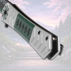 Close-up of knife handle with green and silver design