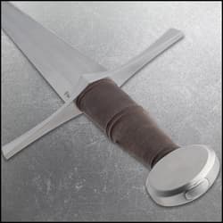 Close-up of sword hilt with brown grip and crossguard