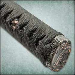 The pommel is intricately designed with dragon detailing.