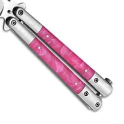 Close-up of pink marble handle on butterfly knife