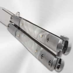 Close-up of butterfly knife handle with pearl pattern