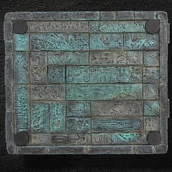Bottom view of a textured box with Dune branding