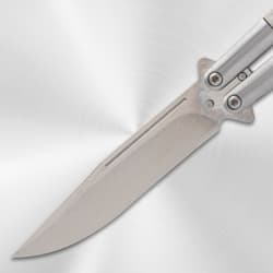 Close-up of butterfly knife blade on metallic background