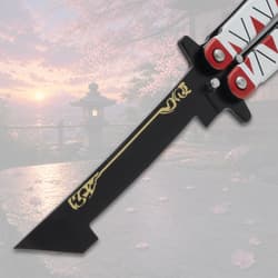 Close-up of butterfly knife blade with decorative design