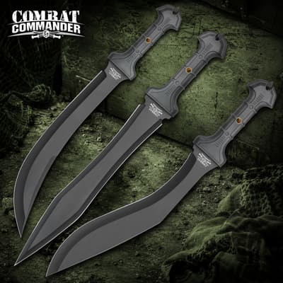 Three black tactical knives with textured handles on a green background