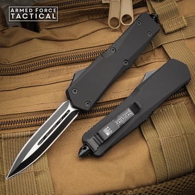 Two tactical knives on a brown backpack