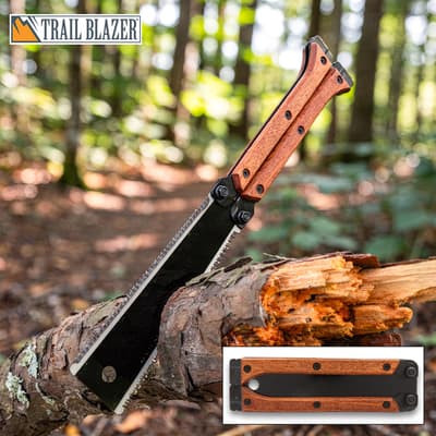 Folding saw with wooden handle on a log in forest