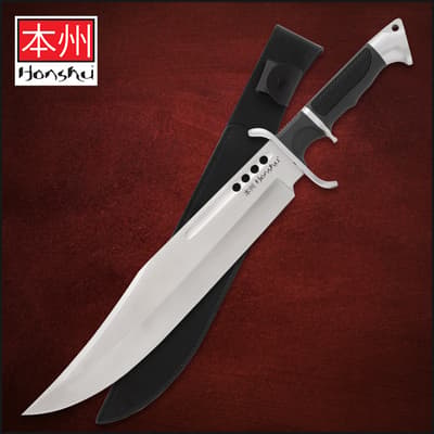 Knife with black handle and sheath on red background