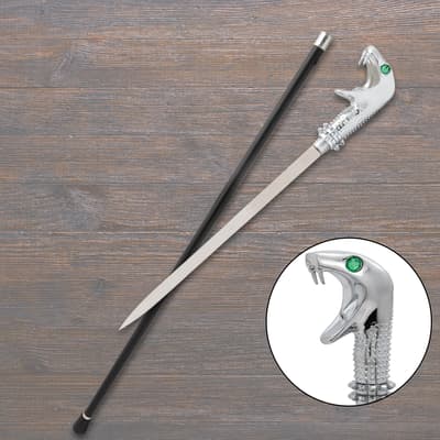 Silver snake-head sword cane on wooden surface