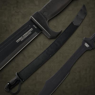Three black combat knives with high carbon steel blades on a textured surface