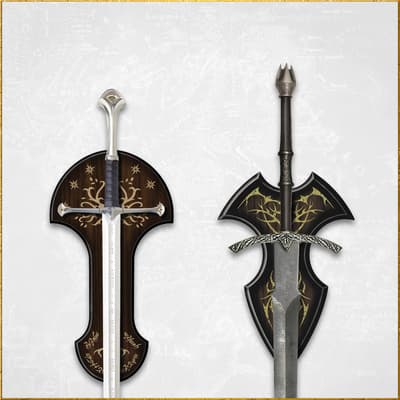 Two swords mounted on decorative plaques with intricate designs
