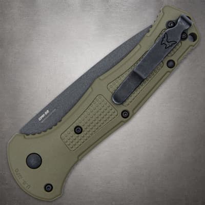 Closed olive drab knife with clip on textured handle