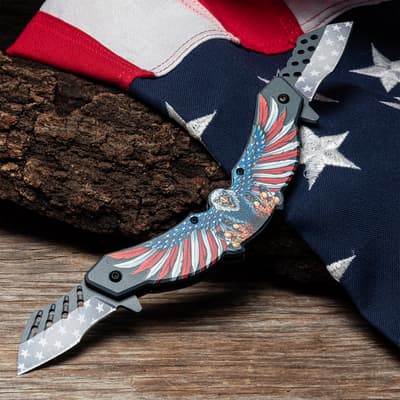 Patriotic knife with eagle design on wood and flag backdrop