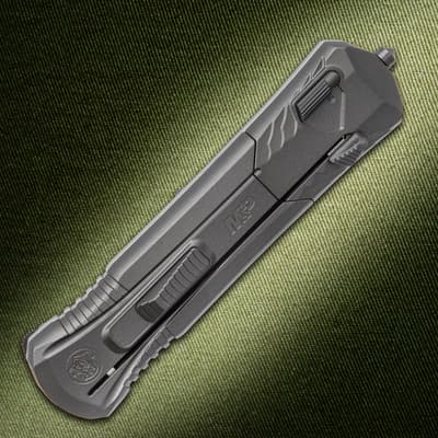 Closed Smith & Wesson knife on textured background