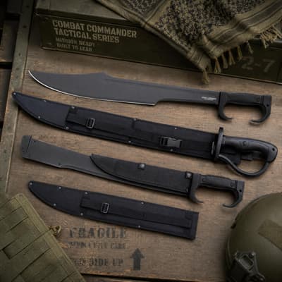Tactical knives and sheaths on a wooden crate with military gear