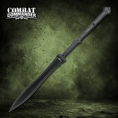 Black sword with a wide blade and textured handle on a green background