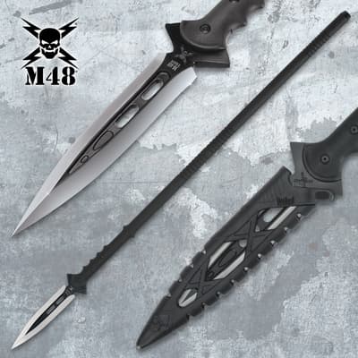 Close-up of black spear with silver blade and sheath