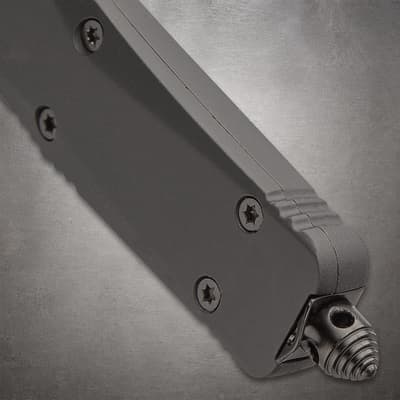 Close-up of a knife handle with screws