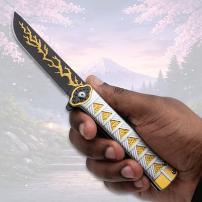 Hand holding a knife with yellow lightning design