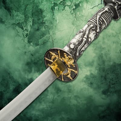 Detailed view of katana's ornate guard and skeleton-themed handle