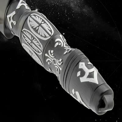 Close-up of a knife handle with ornate designs